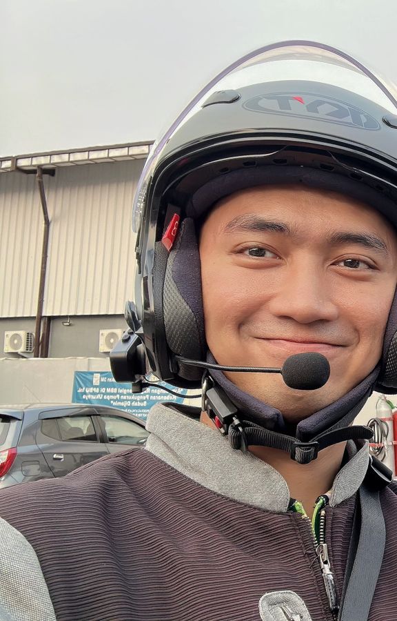 Adryan in a helmet with a headset